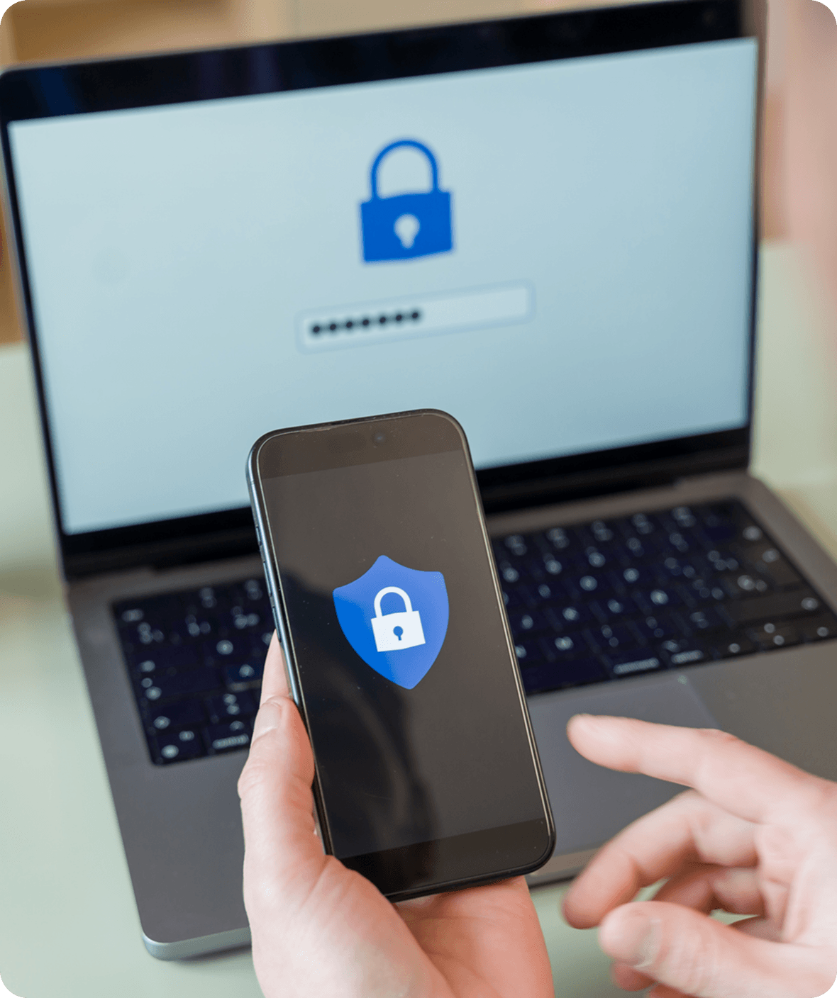 Smartphone and laptop with security icons