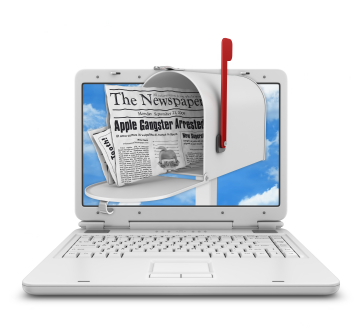 Laptop with a mailbox showing digital newspaper delivery.