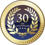 A 30th anniversary emblem with gold laurel wreaths and stars on a dark background.