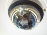 Dome security camera reflecting surroundings.